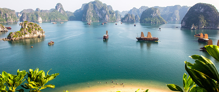 Boats float in the water in Ha Long Bay, Vietnam Boats float in the water in Ha Long Bay, Vietnam