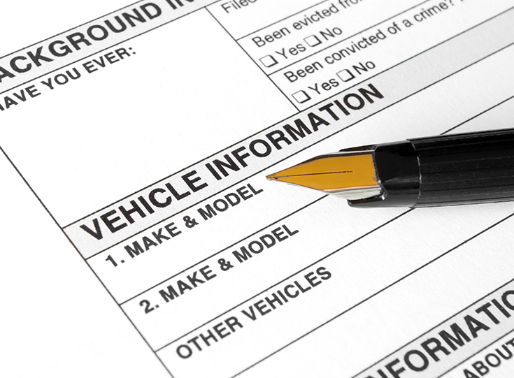 Pen on a vehicle registration form Pen on a vehicle registration form