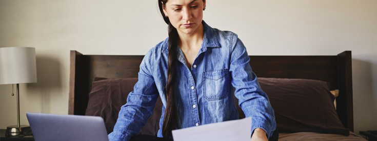 Woman reviewing claim information Woman reviewing claim information