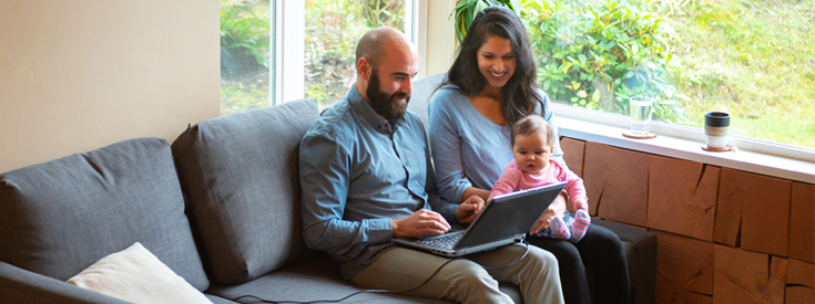 Family looking at laptop Family looking at laptop