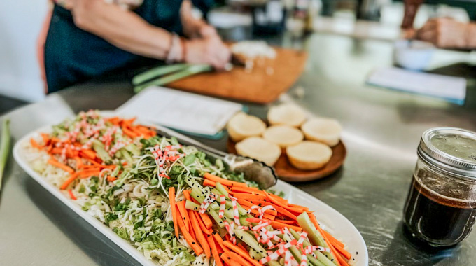 A tray of carrots, lettuce, and other somen salad ingredients.