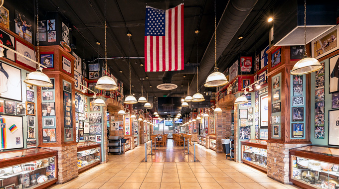 Walls and display cases filled with sports and rock 'n' roll memorabilia inside Sammy C's main room.