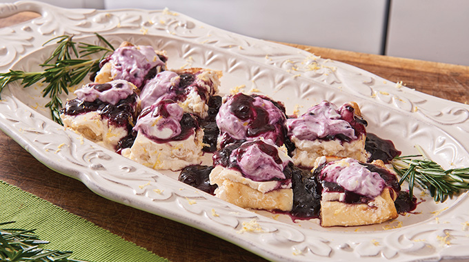 Policinka Crepes topped with blueberry preserves and sour cream