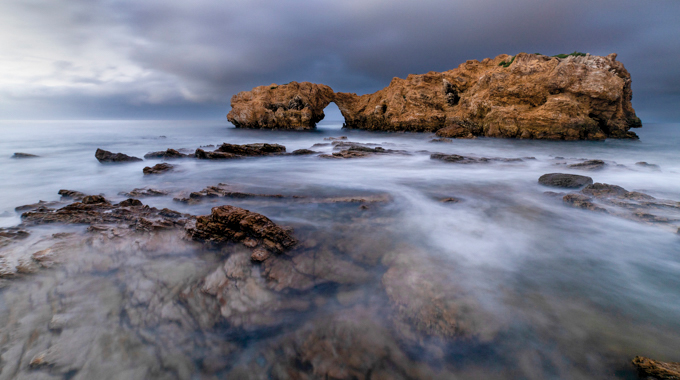 Blue Hour Island by Tracie Cusimano-Williams showing water covering the rocks at Cameo Shores Beach.