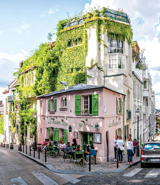La Maison Rose on the corner of a street in Montmartre.