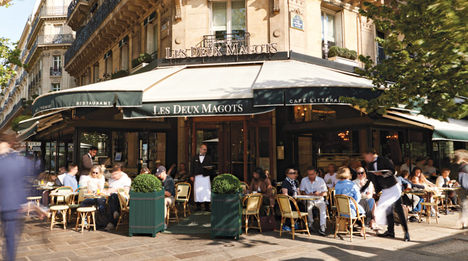 Diners pack the tables at Les Deux Magots.