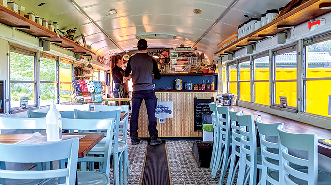 Skool Beans café serves hot drinks in a retro school bus. | Photo by Jessica Fender
