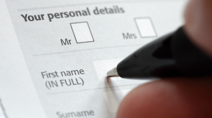 Close-up of someone filing in the "first name" field of an application.