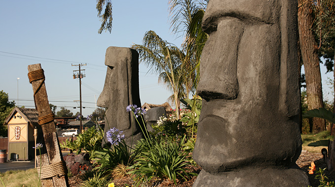 The Mission Tiki Drive-In Theatre is decorated with Rapa Nui statues reminiscent of those found on Easter Island. | Photo by  David Vonderlinn / Courtesy Mission Tiki Drive-In Theatre