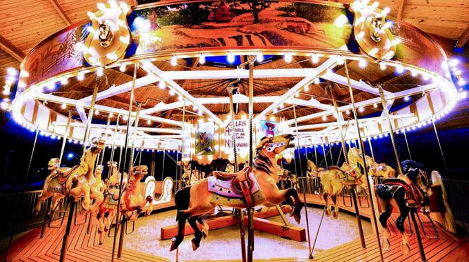 Nemacolin carousel lit up at night.