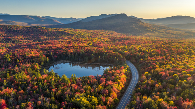 Aerial view of vibrant fall foliage along the Kancamagus Scenic Byway