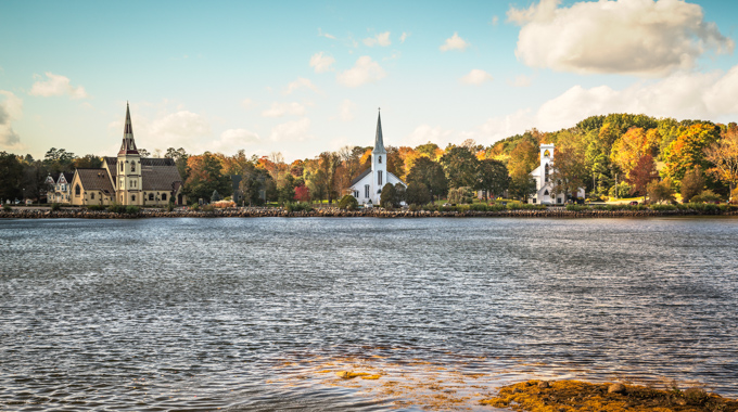 See picturesque Mahone Bay in Nova Scotia in the fall. ©Xavier Ascanio/Adobe Stock