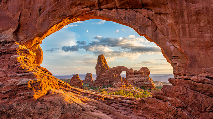 Arrive early for an uncrowded glimpse of The Windows at Arches National Park.